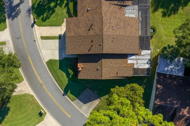 an aerial view of a forest with houses