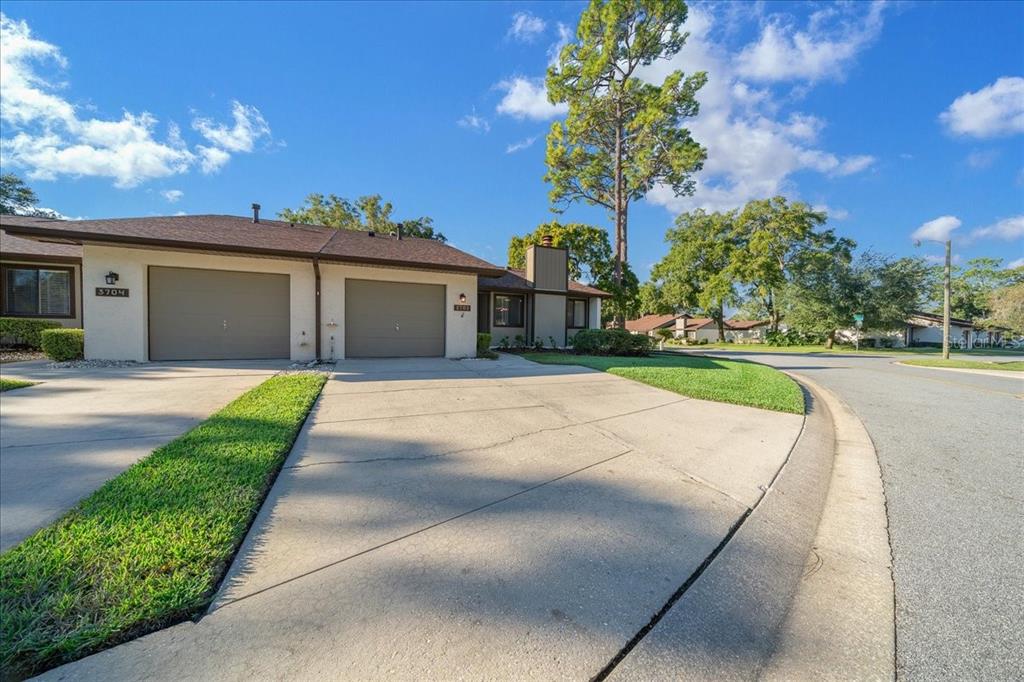 3702 Northeast 17th Street Ocala, FL 34470 - Photo 46 of 70 a front view of a house with a garden and yard
