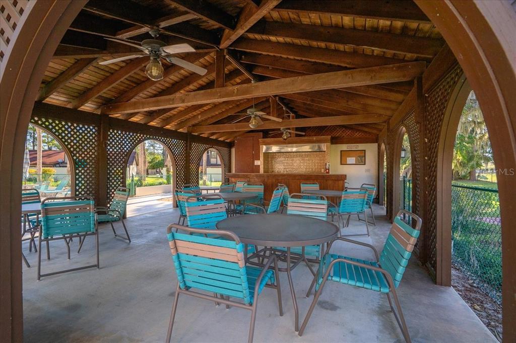 3702 Northeast 17th Street Ocala, FL 34470 - Photo 53 of 70 a dining room with furniture and a floor to ceiling window
