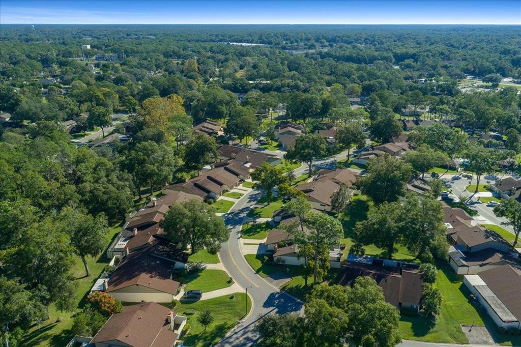 3702 Northeast 17th Street Ocala, FL 34470 - Photo 65 of 70 an aerial view of a forest with houses