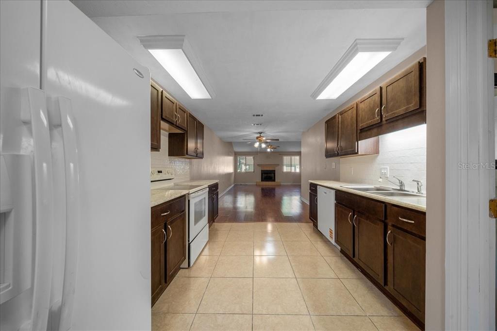 3702 Northeast 17th Street Ocala, FL 34470 - Photo 10 of 63 a large kitchen with stainless steel appliances lots of counter top space