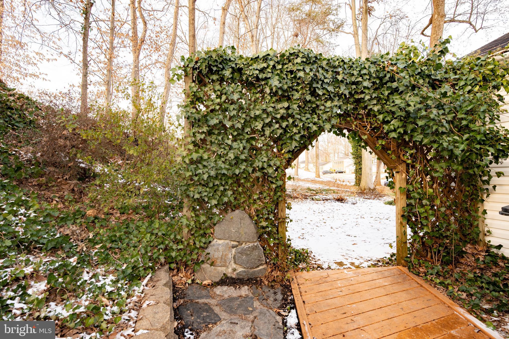 16010 Edgewood Drive Dumfries, VA 22025 - Photo 68 of 85 Landscaped trellis with beautiful ivy.
