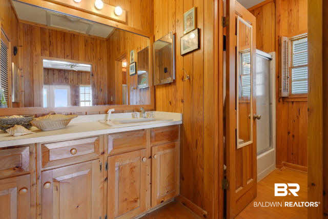 30234 River Road Orange Beach, AL 36561 - Photo 9 of 23 Master bath has separate his and her vanities and large walk-in closet.