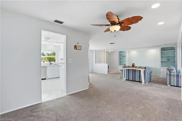 a view of livingroom with furniture and ceiling fan