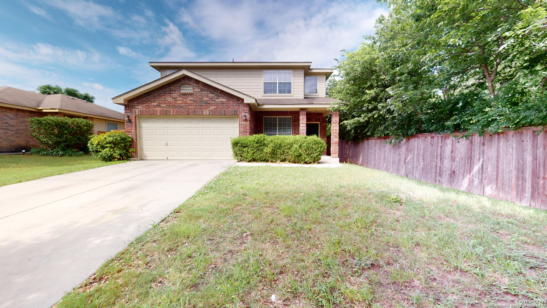 17147 Granger Patch San Antonio, TX 78247 - Photo 1 of 1 a front view of a house with a yard and garage