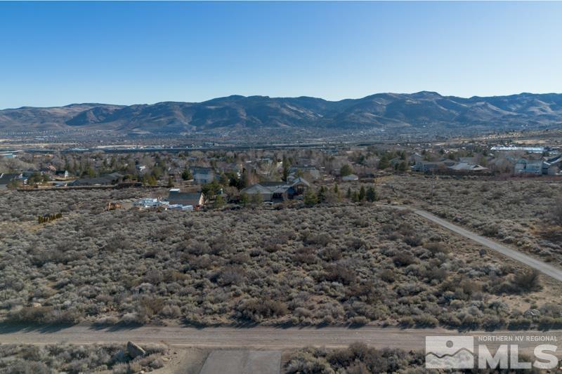 0 Spezia Road Reno, NV 89511 - Photo 13 of 17 a view of a large mountain with a field in middle