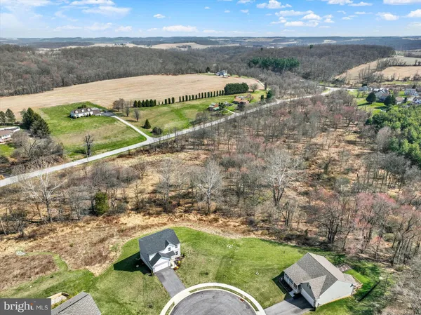 an aerial view of a house with a garden