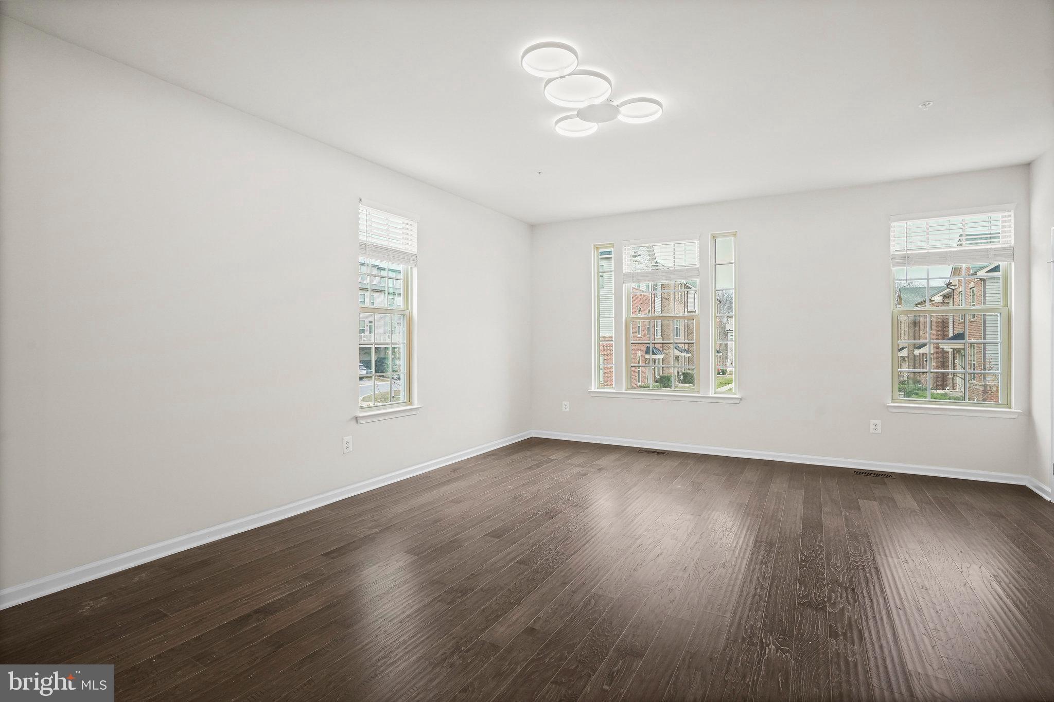 2829 Fredericksburg Road Hanover, MD 21076 - Photo 13 of 37 a view of an empty room with wooden floor and a window