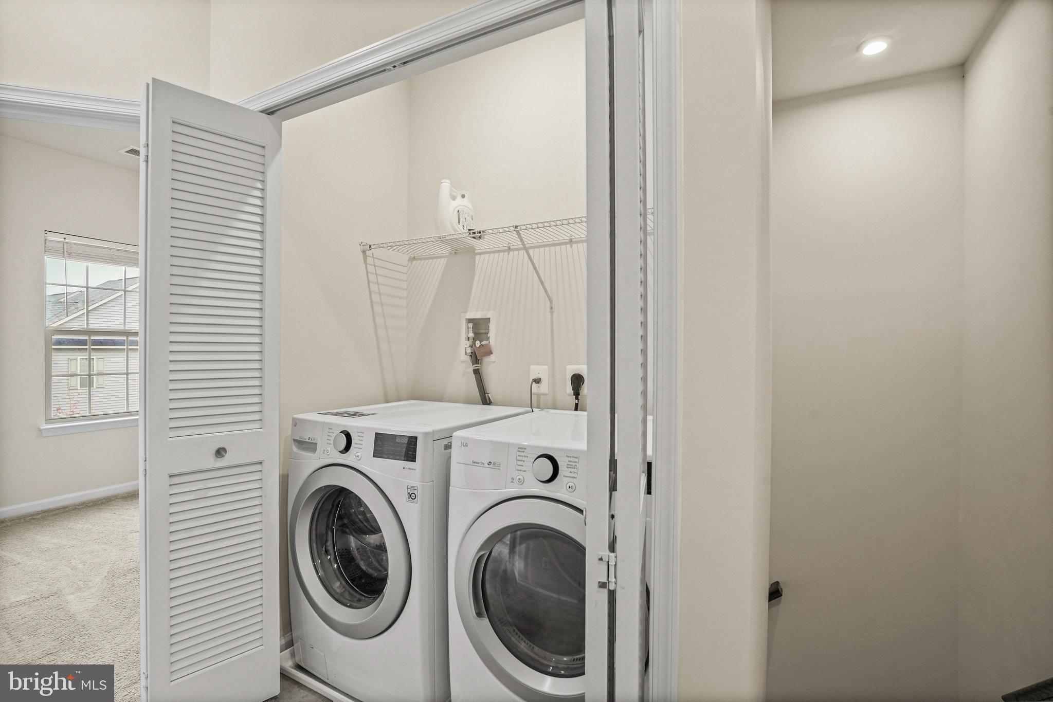 2829 Fredericksburg Road Hanover, MD 21076 - Photo 25 of 37 a view of a hallway with washer and dryer