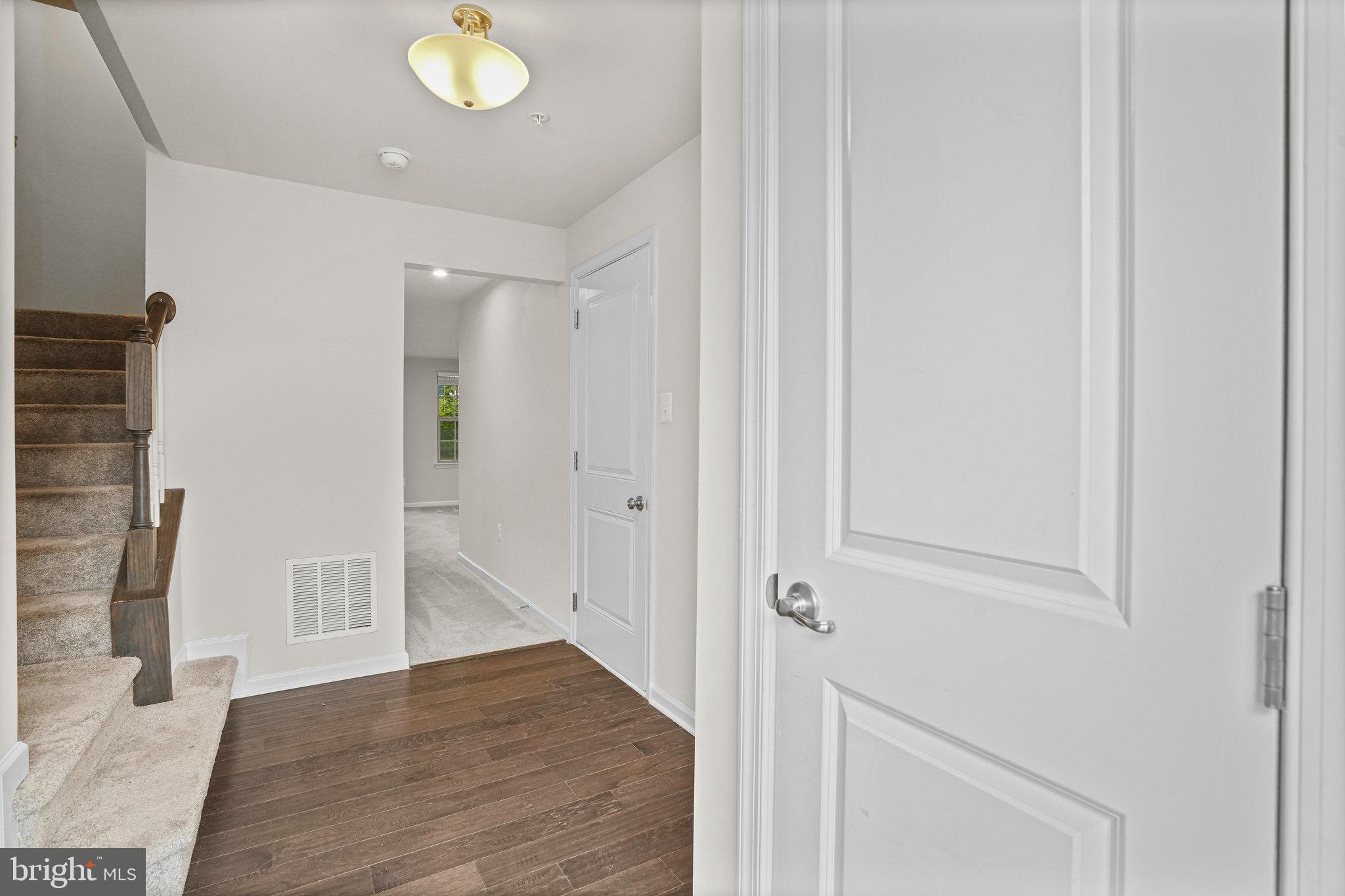 2829 Fredericksburg Road Hanover, MD 21076 - Photo 29 of 37 a view of a hallway with wooden floor and closet
