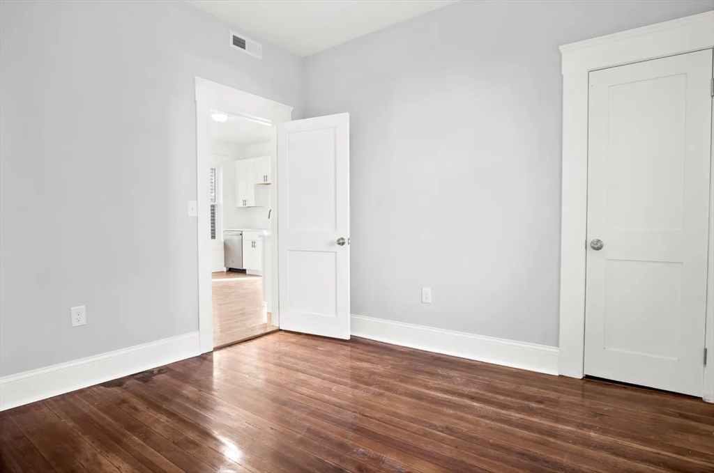 10 Sutton Street Boston, MA 02126 - Photo 22 of 26 wooden floor in an empty room