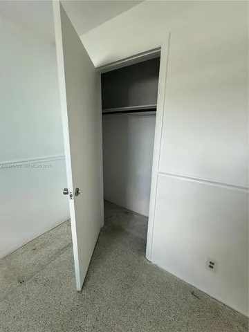an empty room with a door