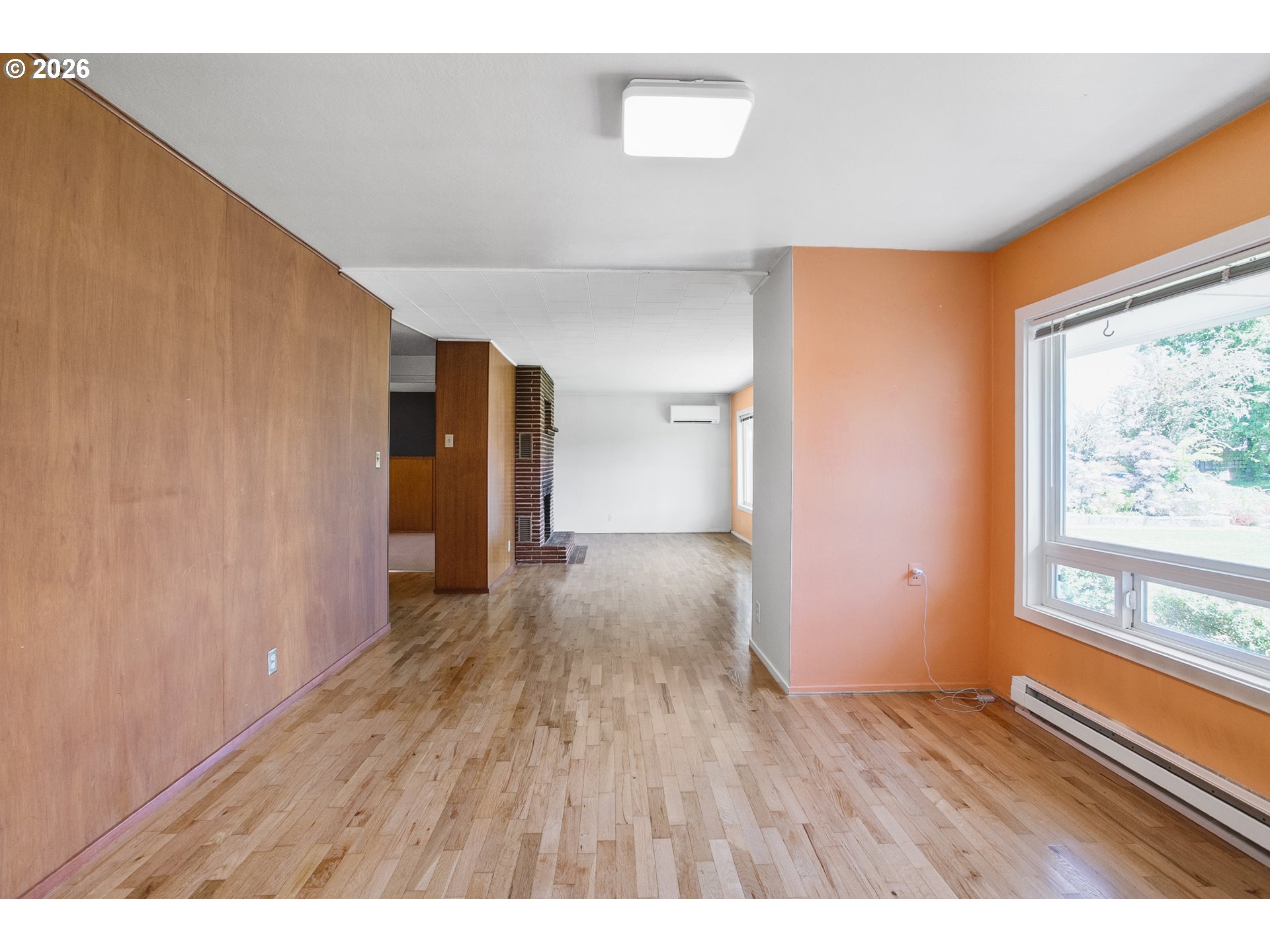 2840 Ferry Street Eugene, OR 97405 - Photo 13 of 35 a empty room with wooden floor and windows