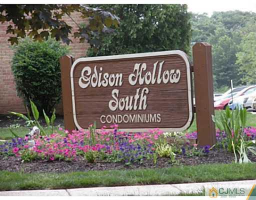 1618 Raspberry Court Edison, NJ 08817 - Photo 2 of 10 a sign on the side of the road
