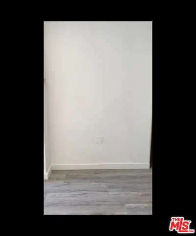 a sink sitting inside of a kitchen with granite countertop