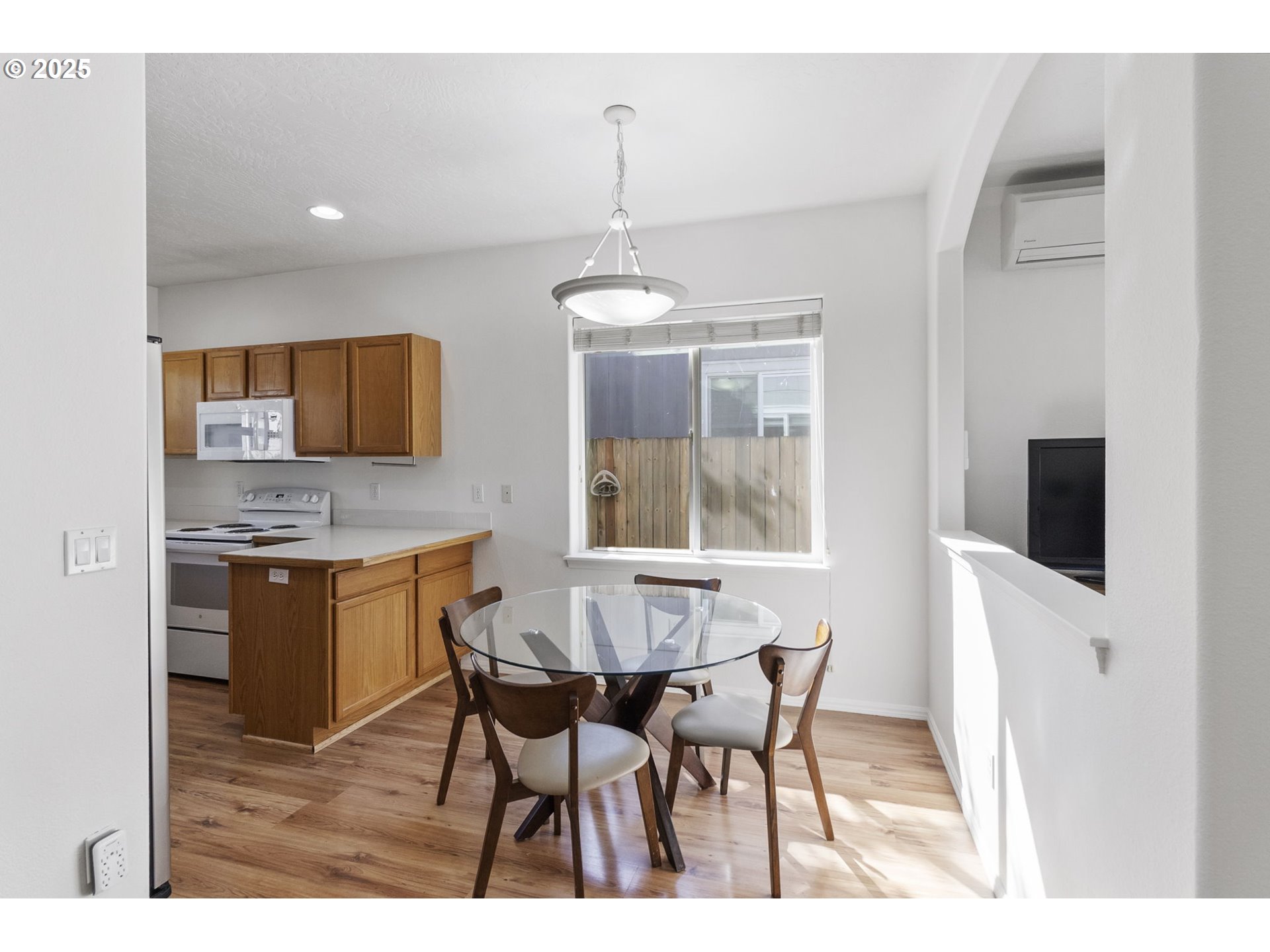 2175 Kelsey Lane Eugene, OR 97402 - Photo 7 of 27 a kitchen with stainless steel appliances granite countertop a sink table and chairs