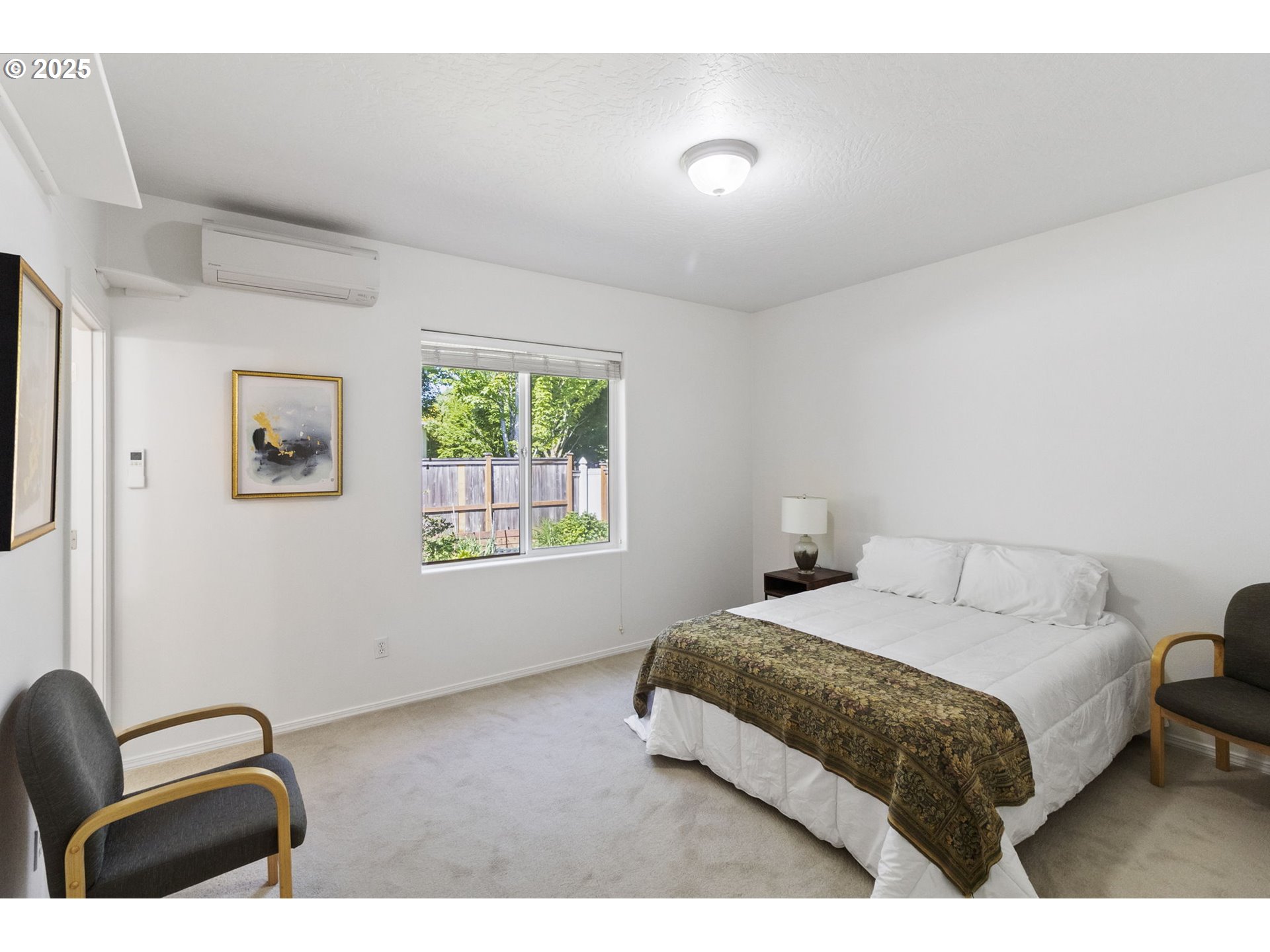 2175 Kelsey Lane Eugene, OR 97402 - Photo 10 of 27 a bedroom with a bed lamp closet and window