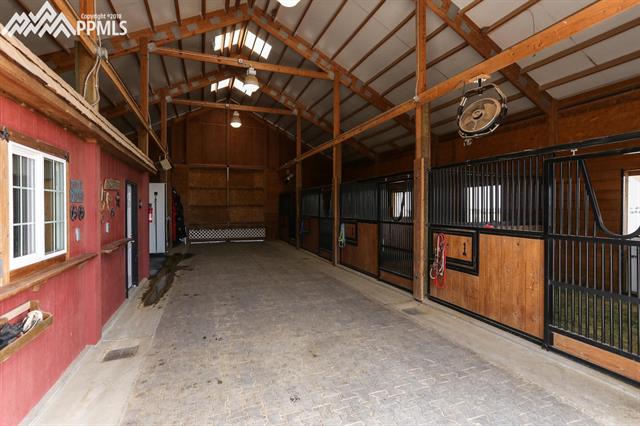 42745 Pearson Ranch Loop Parker, CO 80138 - Photo 34 of 36 Interior of 4-Stall Barn; Wash Bay, Tack Room and Hay Storage