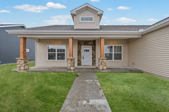 a front view of a house with a yard