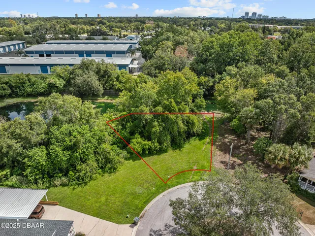 a view of a garden with a building in the background
