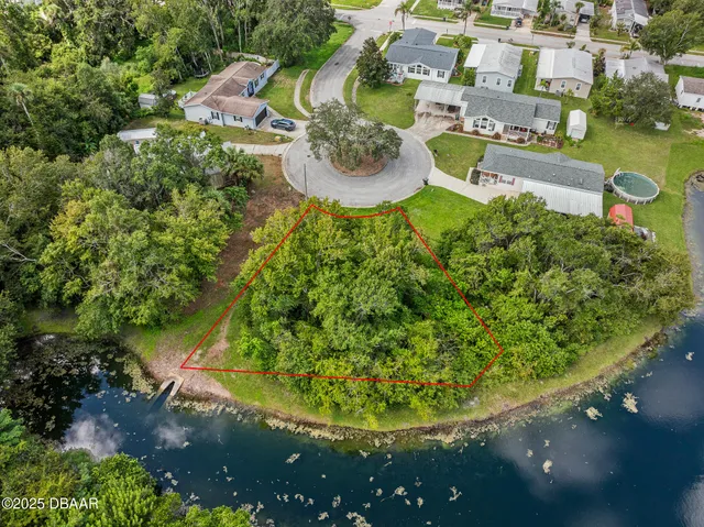 a backyard of a house with lots of green space and garden