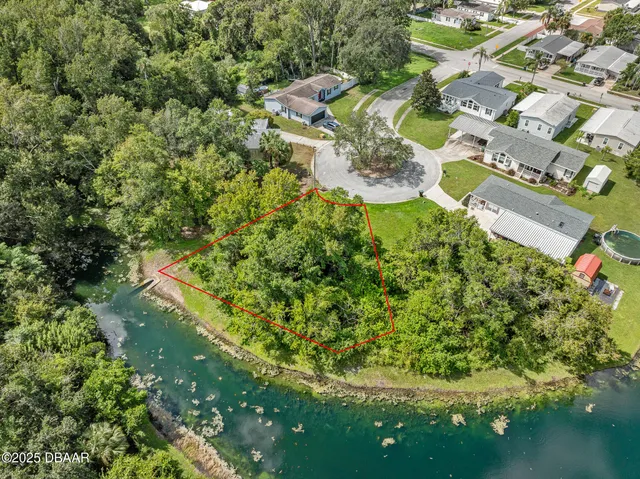 a view of a golf course with plants