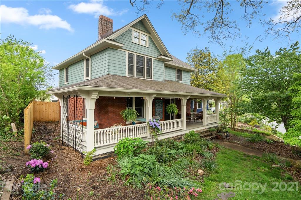 56 Pearson Drive Asheville, NC 28801 - Photo 2 of 44 a front view of a house with a garden