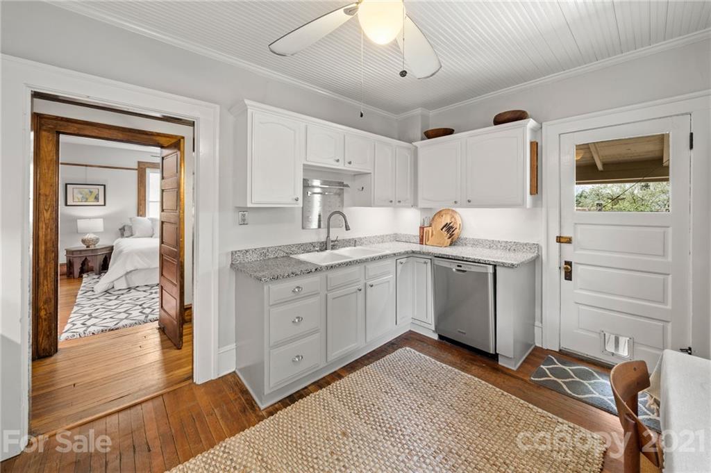 56 Pearson Drive Asheville, NC 28801 - Photo 13 of 44 a bedroom with a bed and a dresser