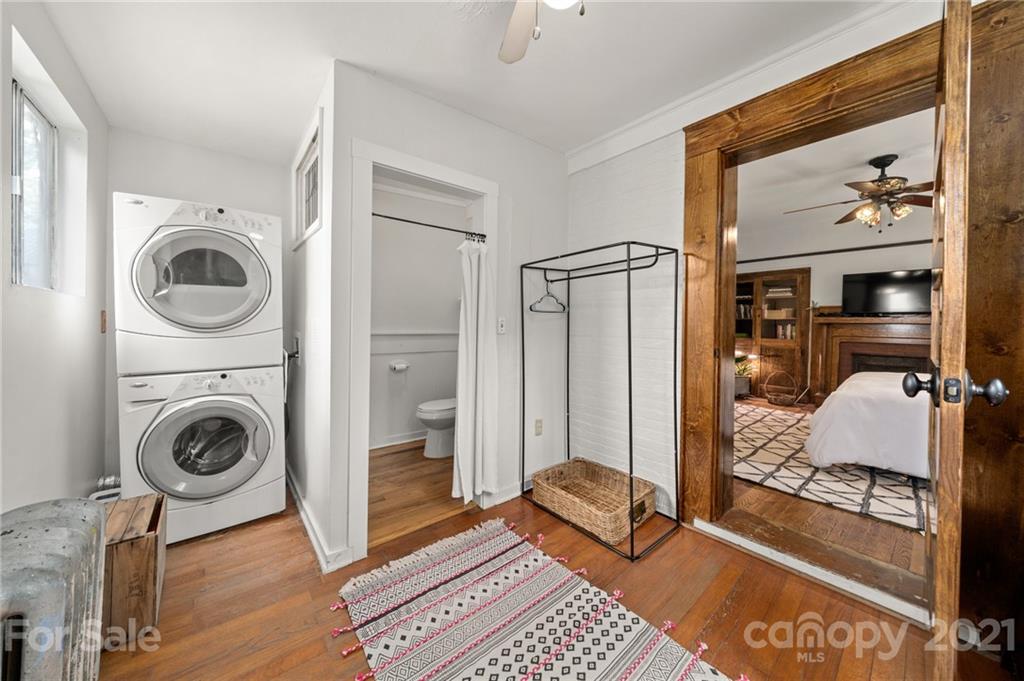 56 Pearson Drive Asheville, NC 28801 - Photo 17 of 44 a room with a couch and a view of bathroom