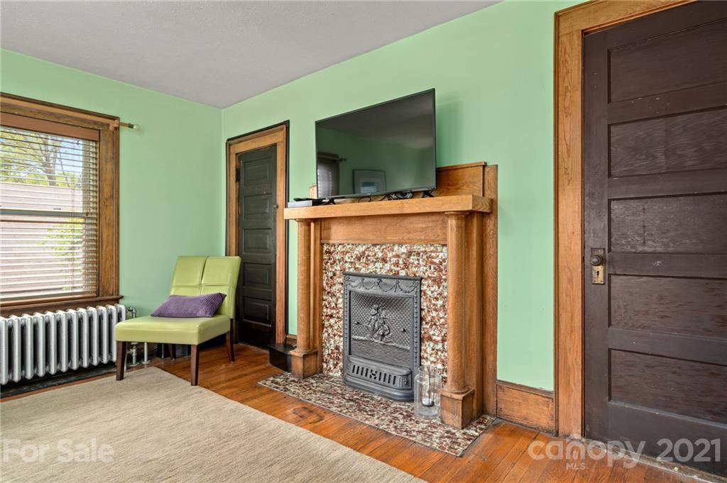 56 Pearson Drive Asheville, NC 28801 - Photo 22 of 44 a living room with furniture and a fireplace
