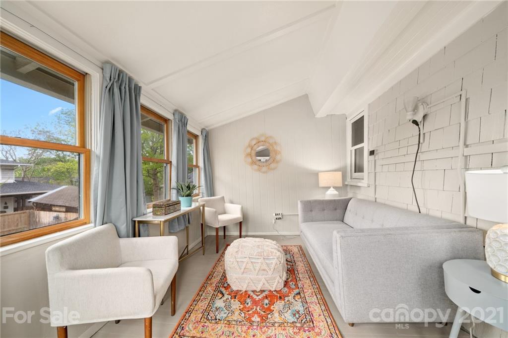 56 Pearson Drive Asheville, NC 28801 - Photo 26 of 44 a living room with furniture and a large window