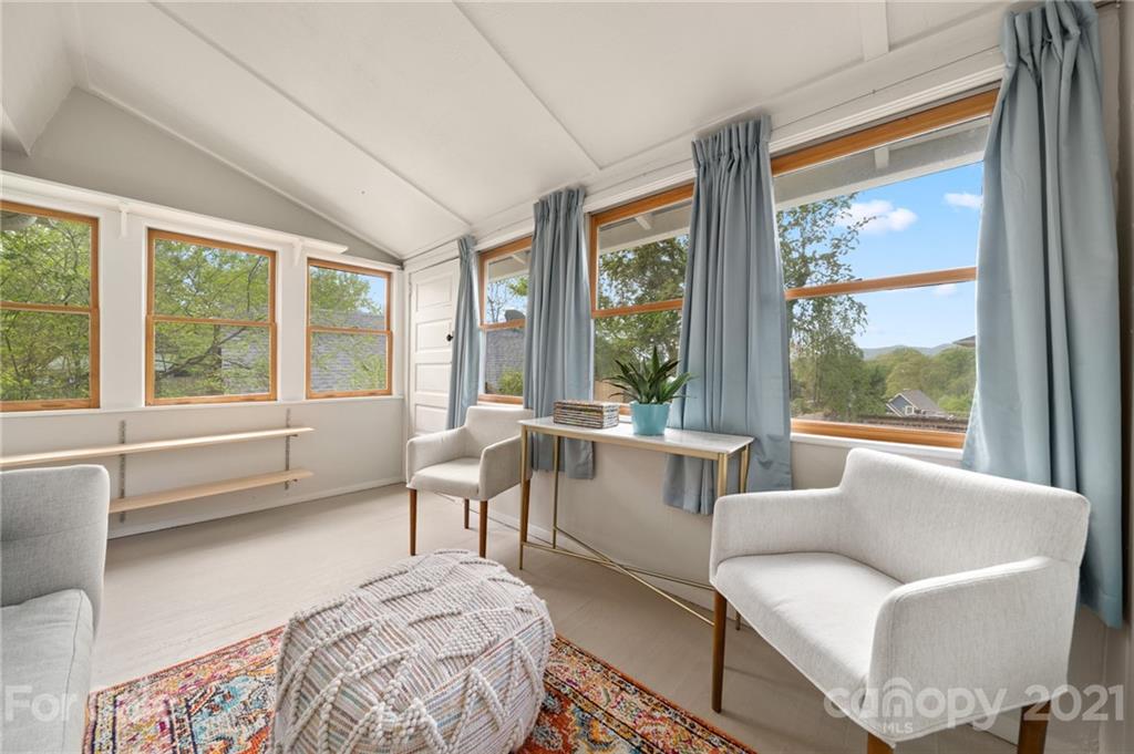 56 Pearson Drive Asheville, NC 28801 - Photo 27 of 44 a living room with furniture and a large window