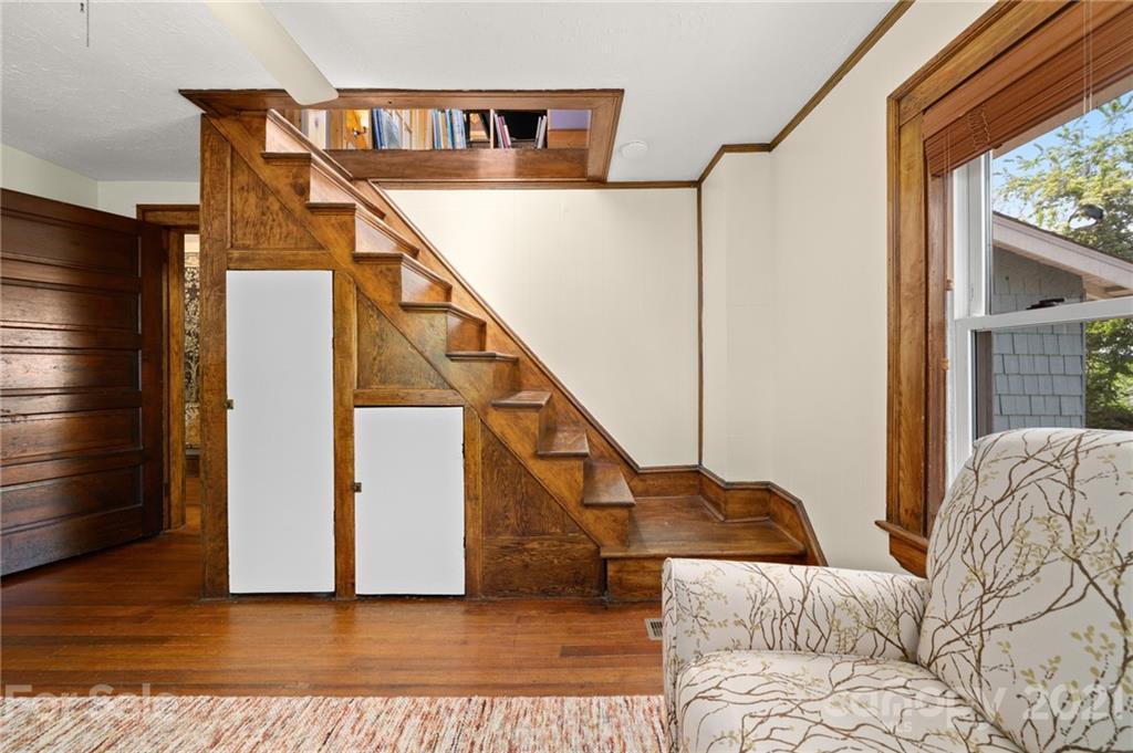 56 Pearson Drive Asheville, NC 28801 - Photo 29 of 44 a view of a livingroom with wooden floor and stairs