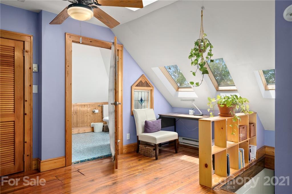 56 Pearson Drive Asheville, NC 28801 - Photo 30 of 44 a living room filled with furniture and a table