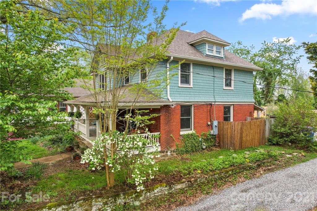 56 Pearson Drive Asheville, NC 28801 - Photo 4 of 44 a front view of a house with garden