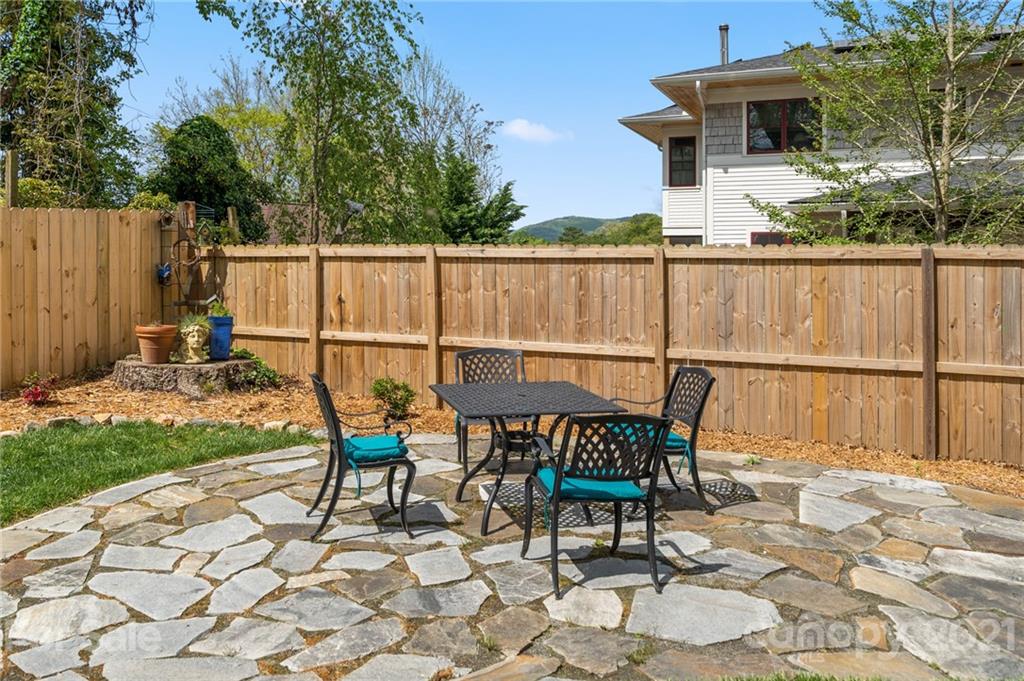 56 Pearson Drive Asheville, NC 28801 - Photo 37 of 44 a view of a chairs and table in the patio