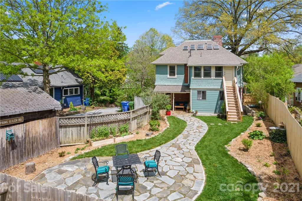 56 Pearson Drive Asheville, NC 28801 - Photo 38 of 44 a view of a patio with couches chairs and a fire pit