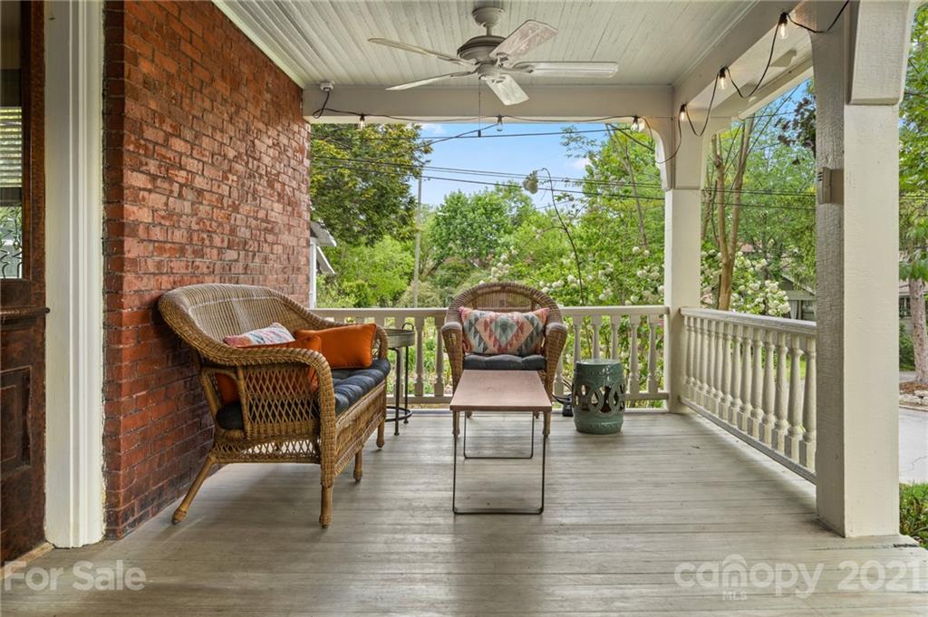 56 Pearson Drive Asheville, NC 28801 - Photo 5 of 44 a view of a porch with furniture and a yard