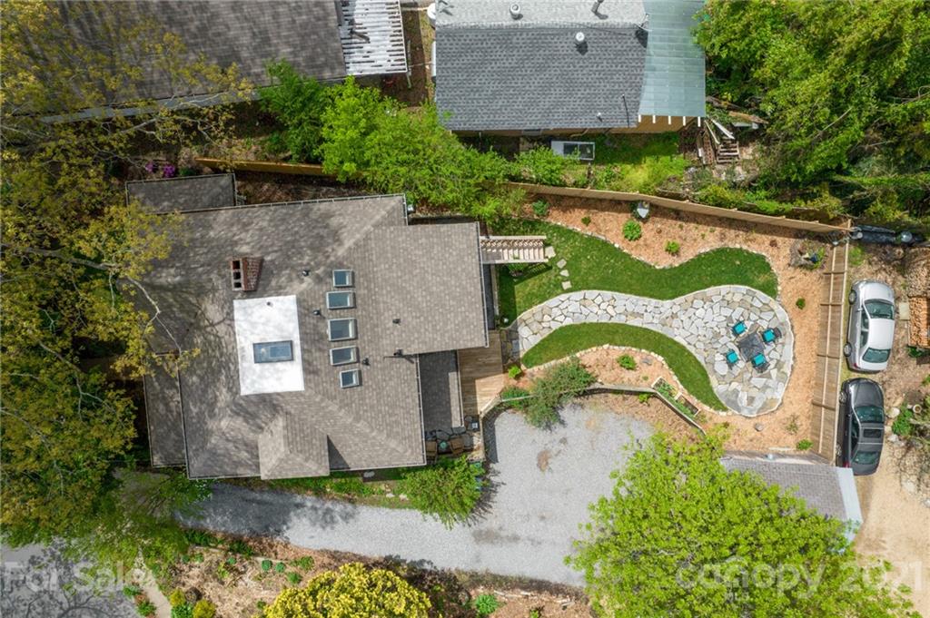 56 Pearson Drive Asheville, NC 28801 - Photo 41 of 44 an aerial view of a house with garden space and a bench