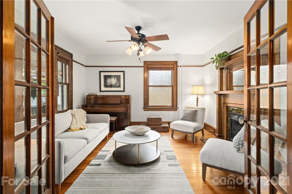 56 Pearson Drive Asheville, NC 28801 - Photo 9 of 44 a living room with furniture fireplace and a large window
