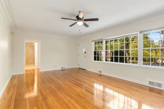 a view of an empty room with a window