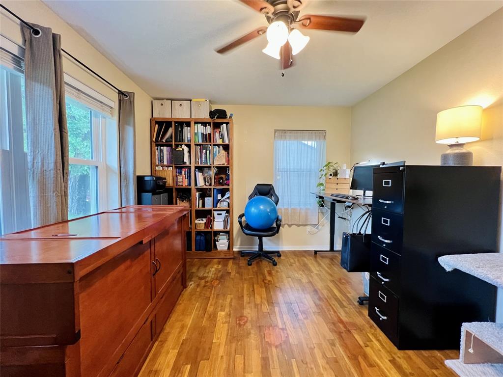 310 West 15th Street Irving, TX 75060 - Photo 15 of 30 a living room with furniture and wooden floor