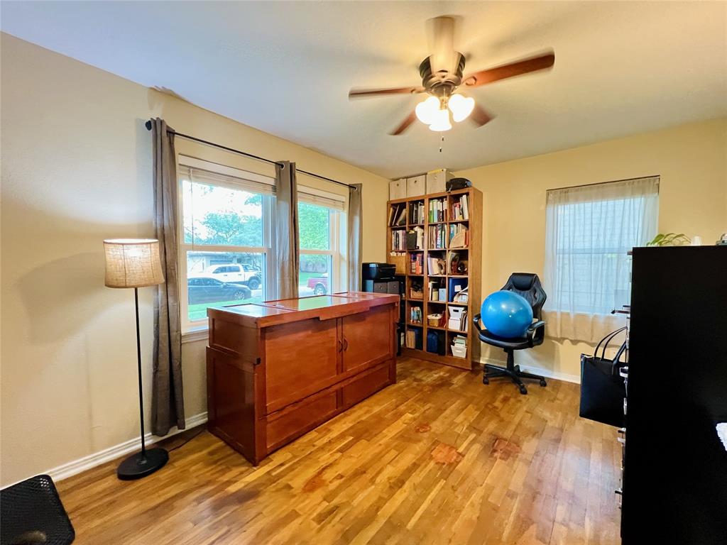 310 West 15th Street Irving, TX 75060 - Photo 16 of 30 a room with furniture and a chandelier