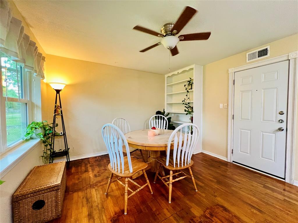 310 West 15th Street Irving, TX 75060 - Photo 23 of 30 a view of a dining room with furniture and a window