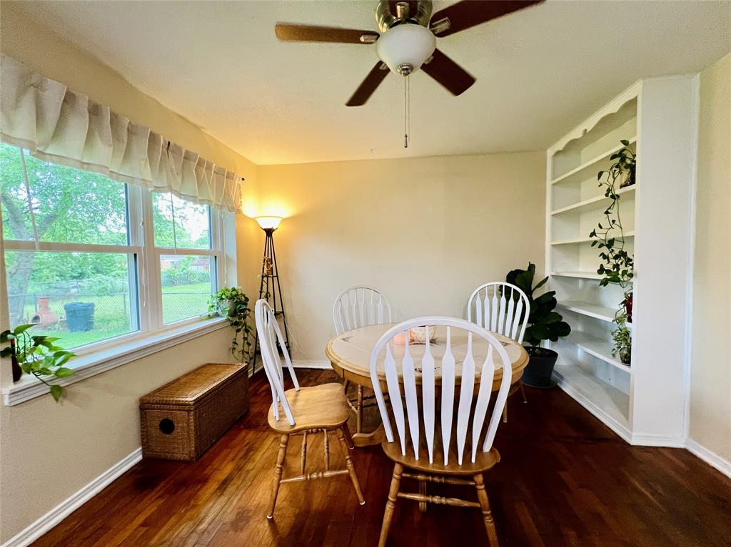 310 West 15th Street Irving, TX 75060 - Photo 25 of 30 a view of a dining room with furniture window and wooden floor