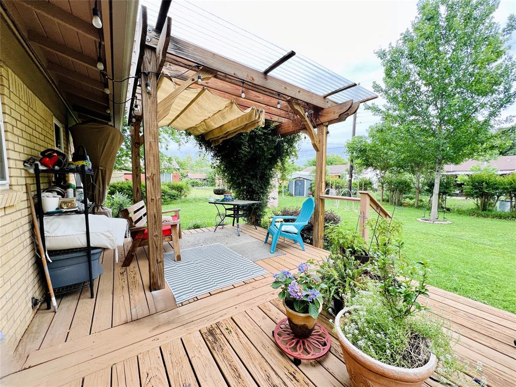 310 West 15th Street Irving, TX 75060 - Photo 26 of 30 a view of a porch with furniture and garden