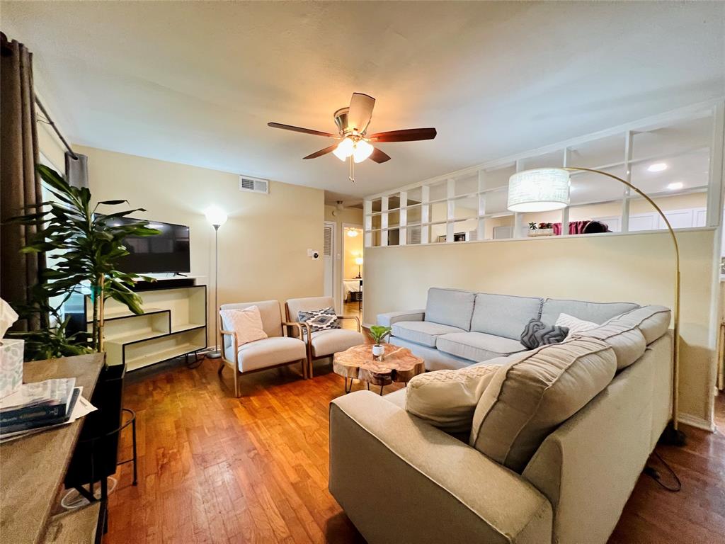 310 West 15th Street Irving, TX 75060 - Photo 4 of 30 a living room with furniture and a flat screen tv