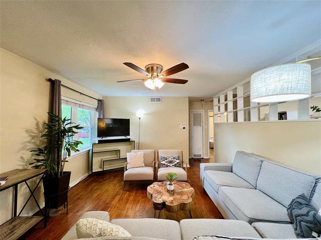 310 West 15th Street Irving, TX 75060 - Photo 5 of 30 a living room with furniture and a flat screen tv