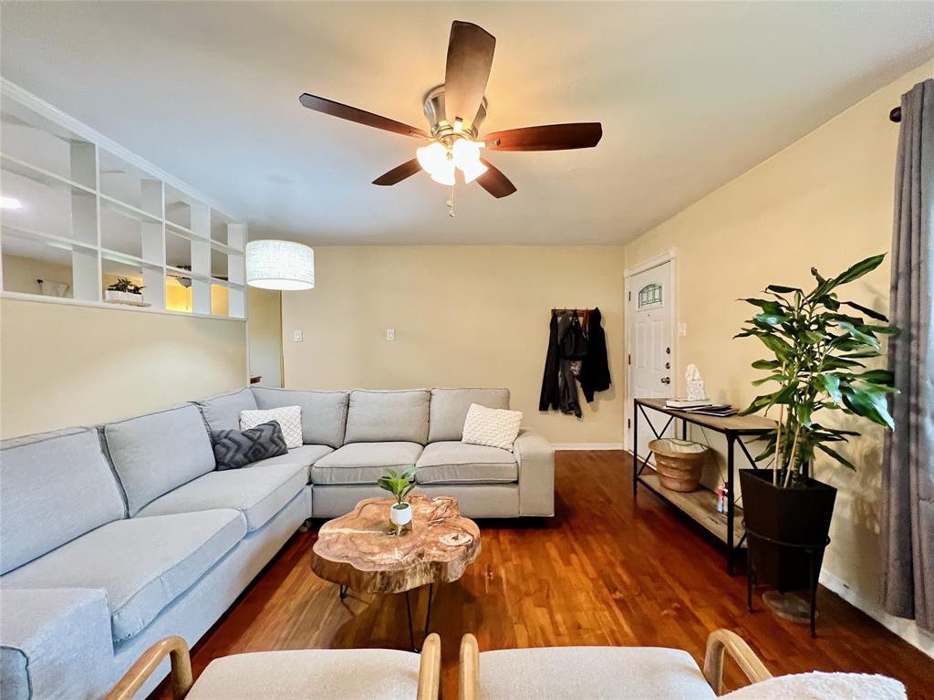 310 West 15th Street Irving, TX 75060 - Photo 6 of 30 a living room with furniture and a chandelier