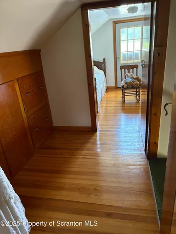 a view of a living room and hardwood floor